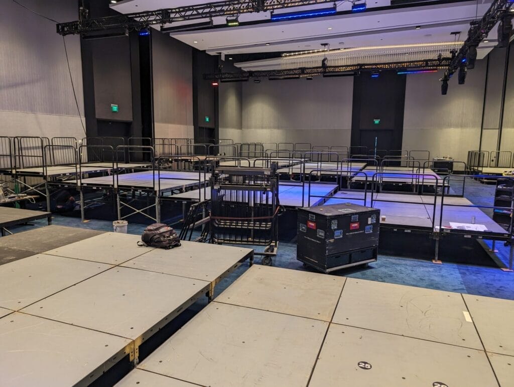 multi tiered risers with safety railings being installed